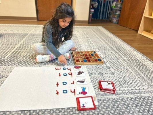 One of our students learning the skills of spelling and rhyming