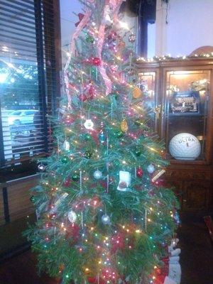 Tree is located by the bar.