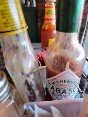 Old condiments! Or needing out of sunny window.