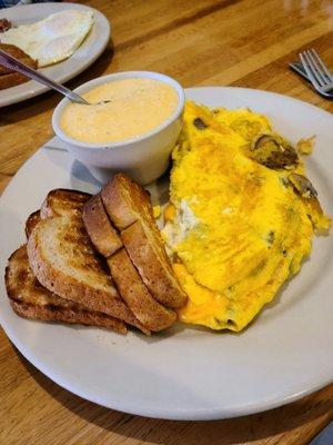 Build your own 3-egg omelet with cheesy grits as my side. Loved the grits.