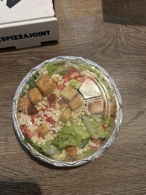 My salad, with cheese when I asked for no cheese.