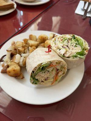 Breakfast chicken wrap with a side of home fries