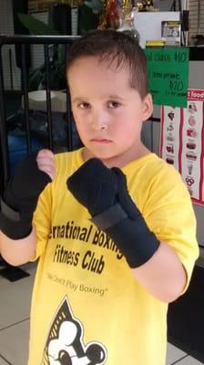 Six years old,  Adam Andrade posing for a photo after a tuff work out.