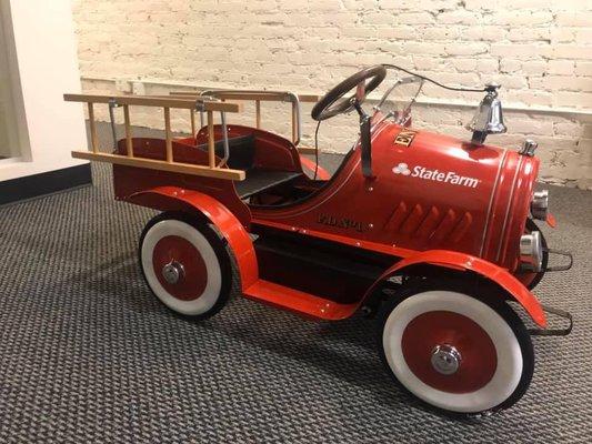 We love this old fashion State Farm Fire Engine