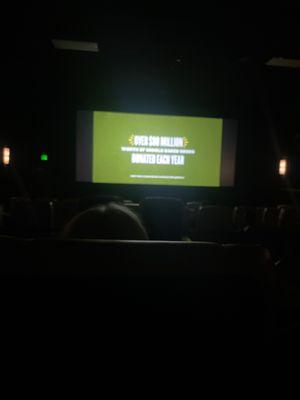 sitting in my seat at the movie theater (this isn't the movie so i can't be sued)