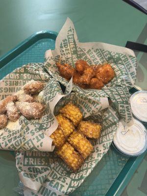 Ranch and blue cheese sauce. Corn, Garlic Parmesan wings, Thai wings (not too sure)