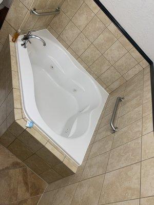 Room with spa tub in it