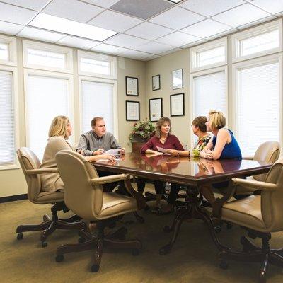 Some of our employees having a meeting in our conference room.