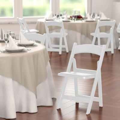 White folding chair with padded seats for rent