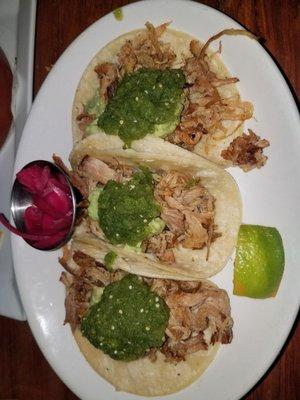 Carnitas tacos with onion on the side