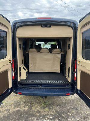 Luggage space seven passenger Ford transit van