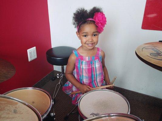 Nia on drums.