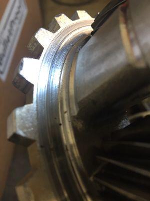 Poor snap ring installation on a 4R100 caused the sun gear to wear a groove into this planetary gear set, aluminum through out the trans