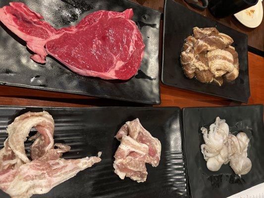 Rib Eye, Marinated La Galbi, Thinly Sliced Pork Belly, and Baby Octopus at Kogi Gogi BBQ in San Francisco.