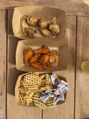 Buffalo and lemon pepper wings with waffle fries