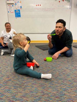 Having fun in an Early Childhood music class for babies and toddlers.