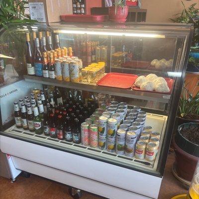 Cooler with selections of wine and beers.