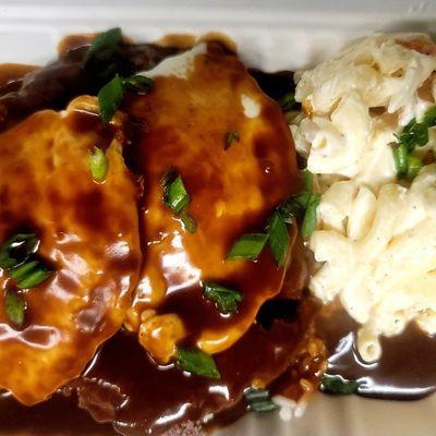 Loco Moco - burger patty on a bed of white rice topped with 2 fried eggs and smothered in gravy