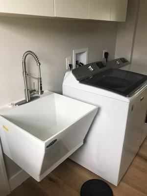 Remodel Wall hung porcelain laundry sink with LK single lever faucet. Washer and gas dryer supply install.