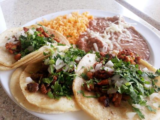 $5.59 special: 3 tacos, rice, beans, + medium drink. [Al pastor, asada, pollo, + horchata]