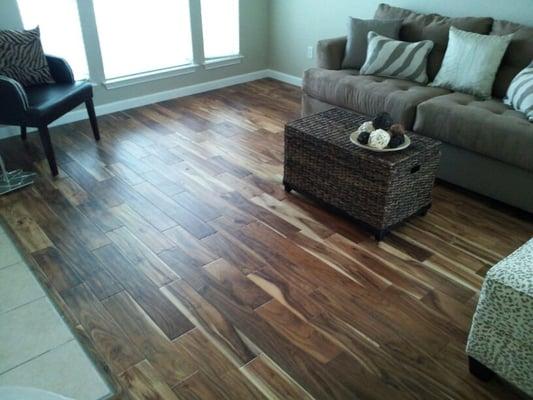 We carry and install exotic woods. Actual install Acacia wood in living room.