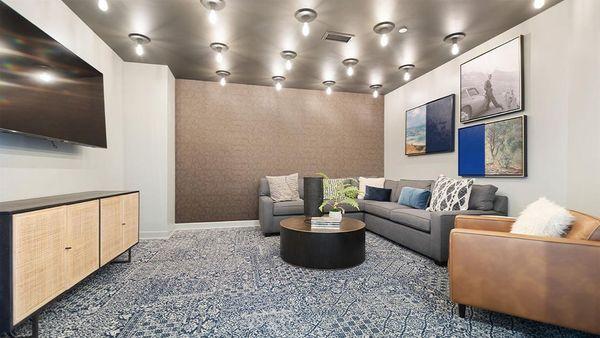 Apartment community media room with tv at Griffis South Bay in Milpitas, California.