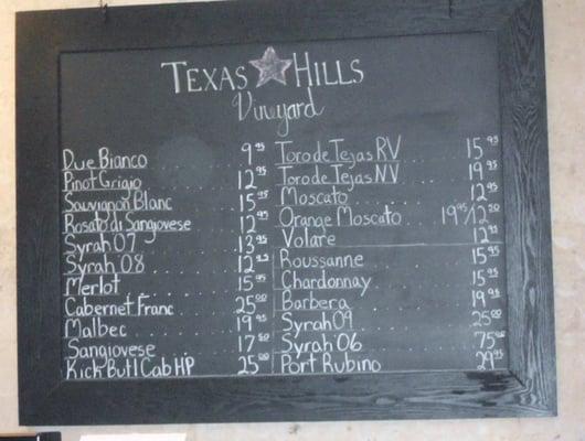 Chalkboard in tasting room lists wines available by bottle