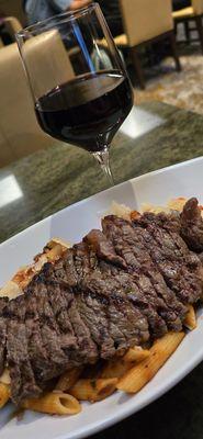 Roasted vegetable pasta with steak and a glass of Bogle Zinfandel