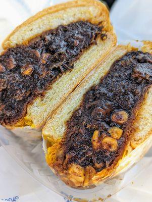 Beef patty with oxtail and Mac and cheese sandwich