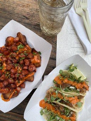 Patatas bravas with chrorizo and carnitas tacos