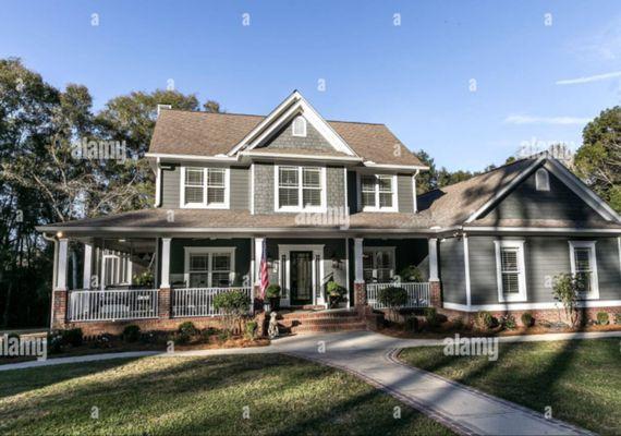 This gorgeous house had Roof Siding, Windows and trees removed services