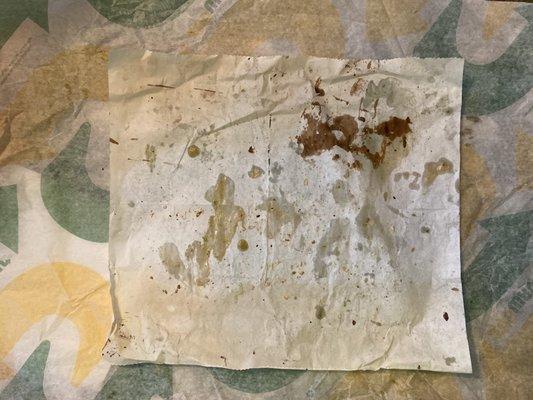 Prep deli paper stained with residue in uncleaned toasting pan