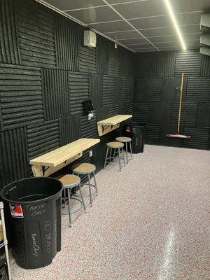 Loading counters and ballistic panels for safety and sound, which line the entire ceiling and midway down the range all the way back around.