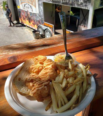 New to our menu, the shrimp po'boy! Yum, with fries of potato salad as a side and dripping in a specialty sauce and slaw.