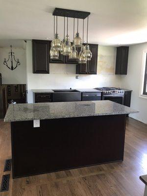 New cabinets and granite / espresso cabinets and oyster pearl granite