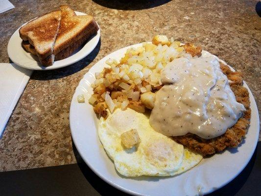 Chicken fried steak, home fries and eggs!! Oh yeah with toast!