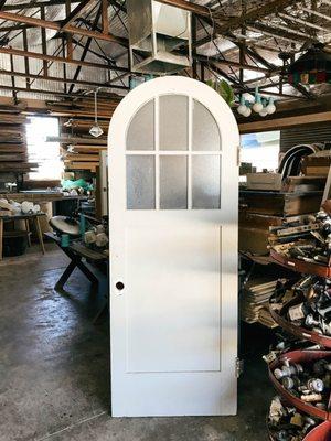 Salvaged arch door in Originate's salvage yard | Tucson, AZ