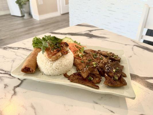 Grilled Pork, chicken, shrimp, egg roll entree with steamed rice