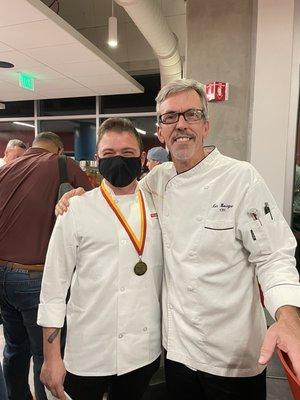 Chef Samson with his graduating professor, Chef Ken Bourgoin, at the graduating medal ceremony.