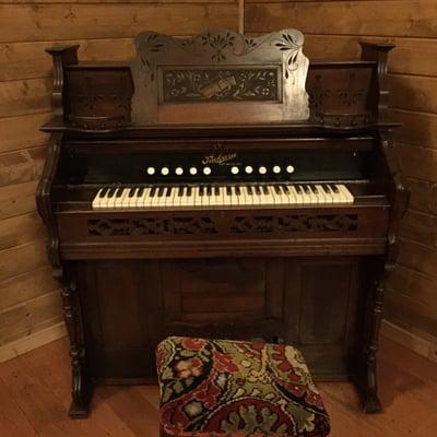 Old pump organ inside the chapel on the property