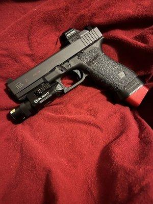 Glock 21sf with Holosun red dot, Taran Tactical base pad, Trijicon suppressor height iron sights and OLIGHT Baldr Pro.