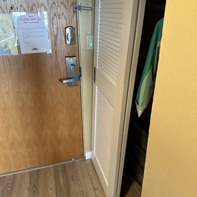 Closet door is falling off of the ceiling and cannot be slid open or closed.