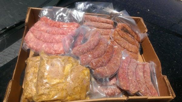 Packages of delicious sausages and marinated chicken thighs n_n