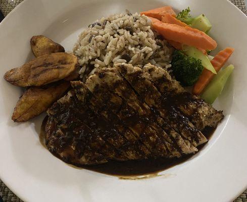 VI Jerk Chicken breast, rice and peas, fried plantains and vegetables