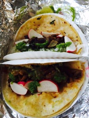 Bad lighting but one is pork al pastor and other is lengua. Food is delicious but they overcharged me, see review.