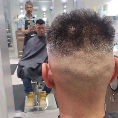 Men's mid skin fade . clipper and scissors hair cut