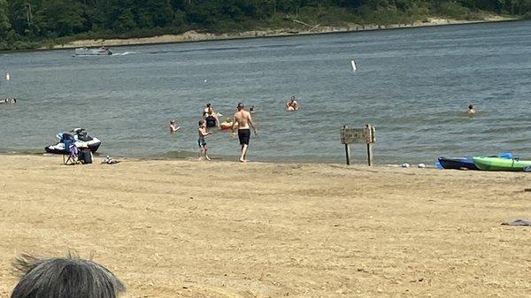 jet ski that was rode into the restricted swim area and left on the beach