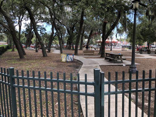 Entrance to park from library parking lot. Also, additional parking behind the library.