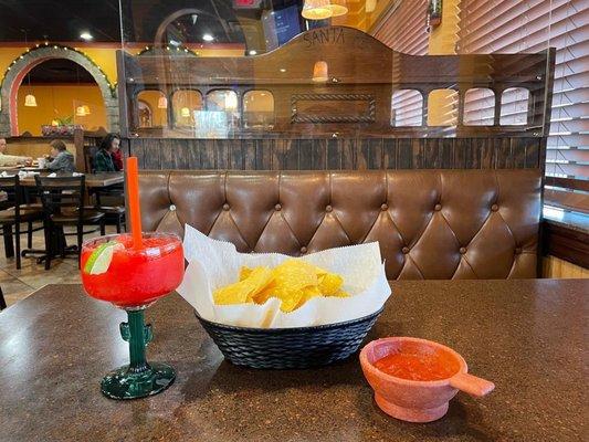 Frozen strawberry margarita and chips and salsa