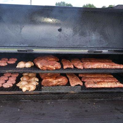 Smoker loaded up with pork, chicken, ribs & burgers.